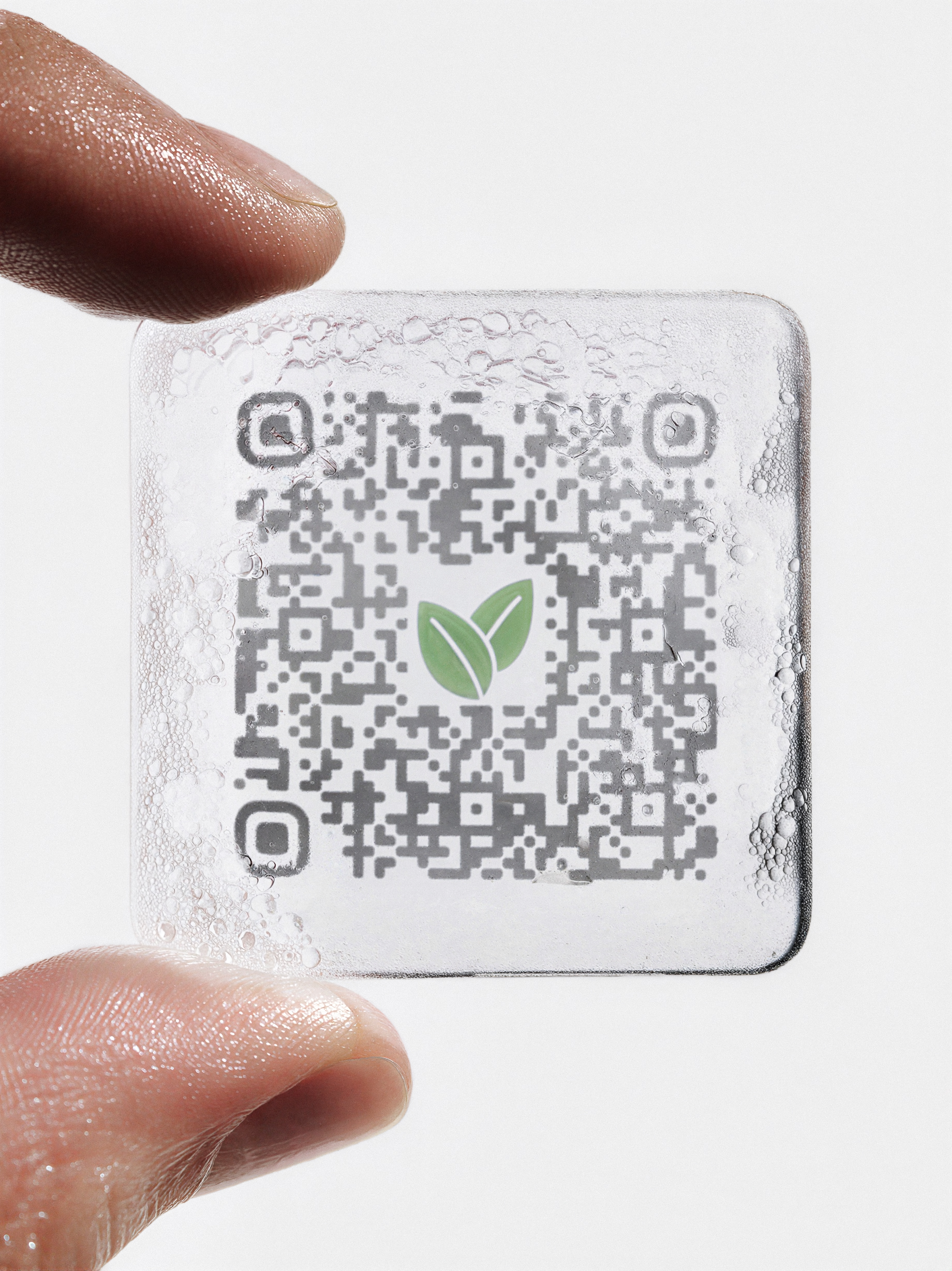 Apres wellness patch held between fingers